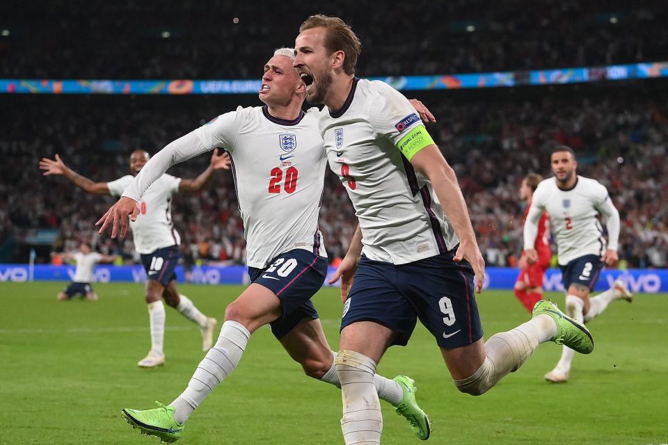 Harry Kane wheels away in celebration after requiring two bites of the cherry from the spot