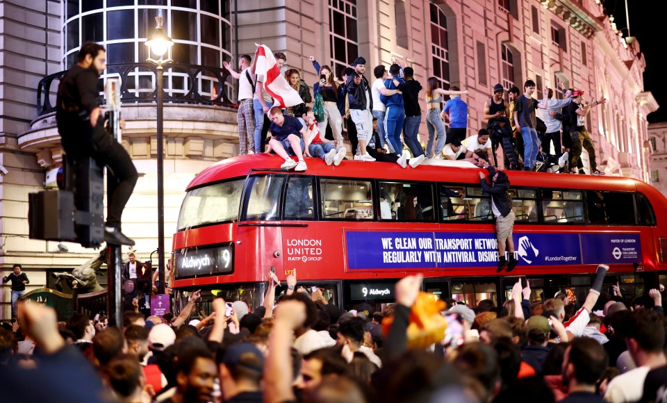 Others hyped footie fanatics were snapped mounting lampposts, buses and telephone boxes