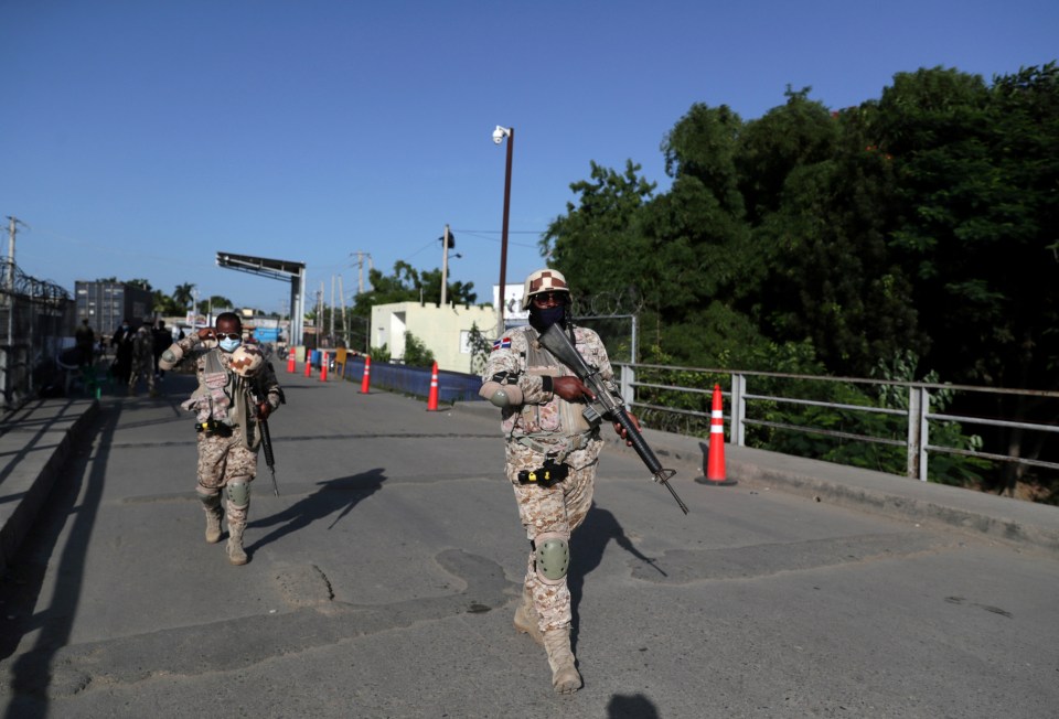 Dominican Republic army guards patrolling the bridge between the Dominican Republic and Haiti