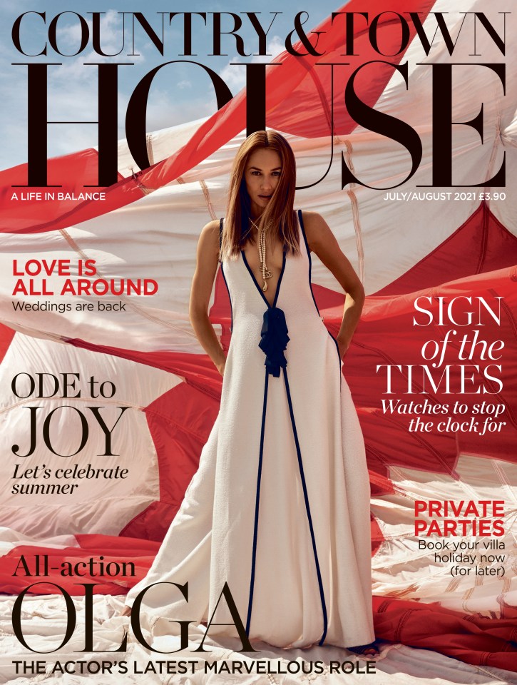 Beautiful Olga modelled a plunging white gown for the front cover