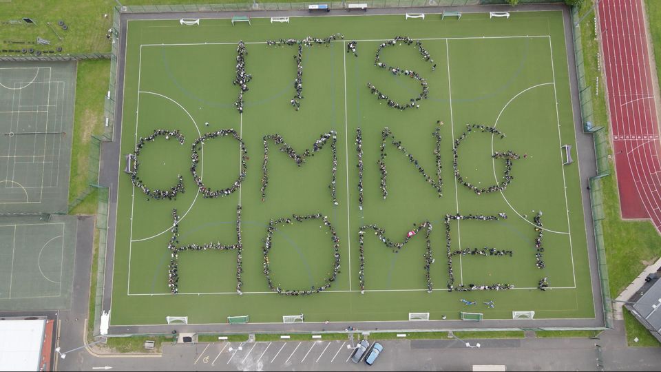 Pupils from Stratford upon Avon School in Warwickshire lining up spell 'It's Coming Home' ahead of the England final on Sunday