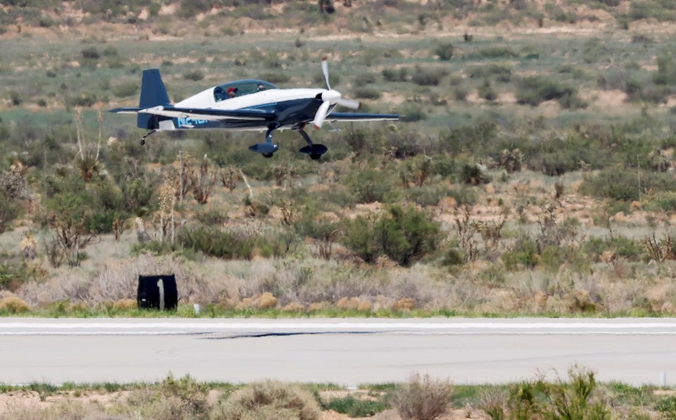 A test pilot lands near the Virgin Galactic hangar complex a day before billionaire entrepreneur Richard Branson travels to the edge of space in the company's passenger rocket plane VSS Unity, near Truth or Consequences, New Mexico