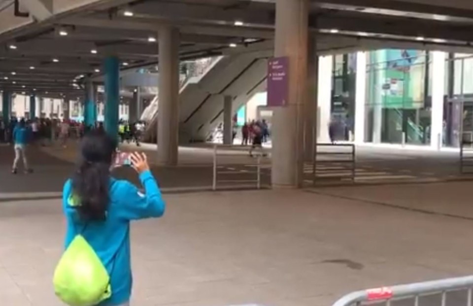 Supporters can be seen making their way up the escalators at the stadium