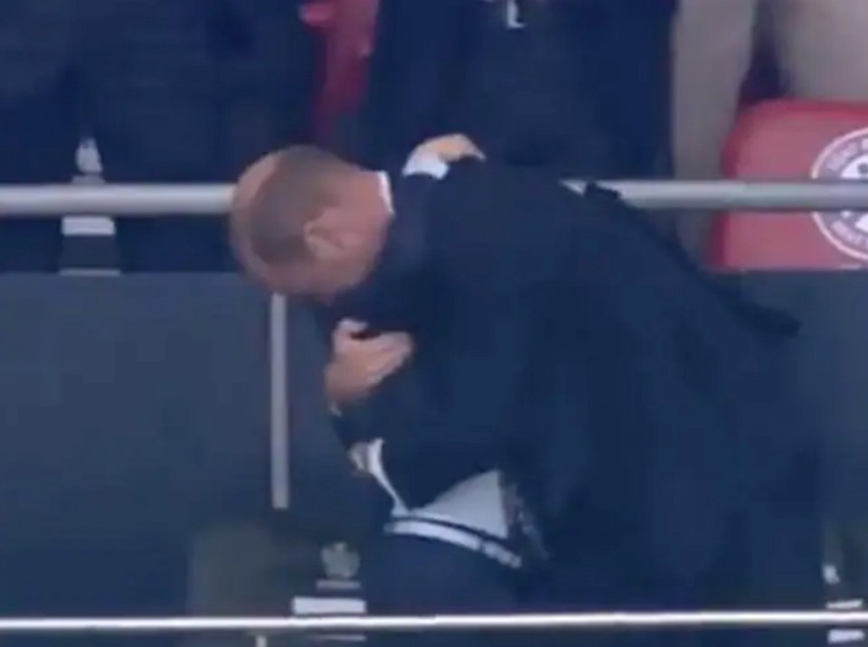 Cameras caught the sweet moment George instinctively rushed to hug his dad