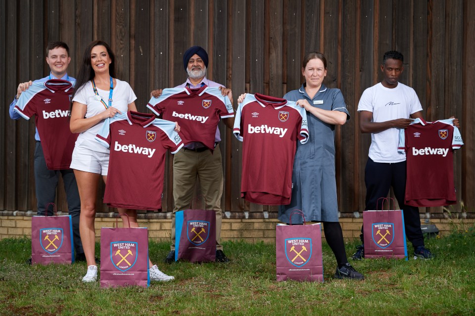 These Hammers fans - Lindsey Wood, Tony Kaura, Biruk Tessema and John Mealey - from Barking, Havering and Redbridge University Hospitals NHS Trust were given exclusive early access to the Umbro gear