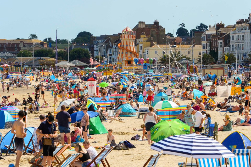 Families packed a beach in Dorset today