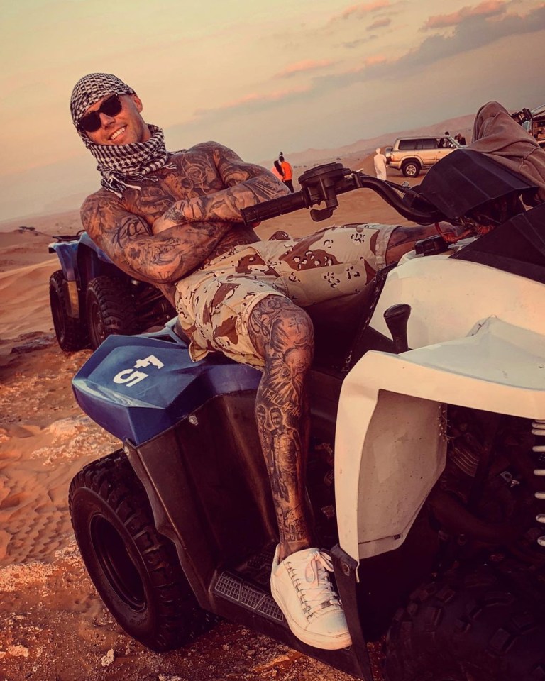 The tattooed hunk goes quad biking in Dubai