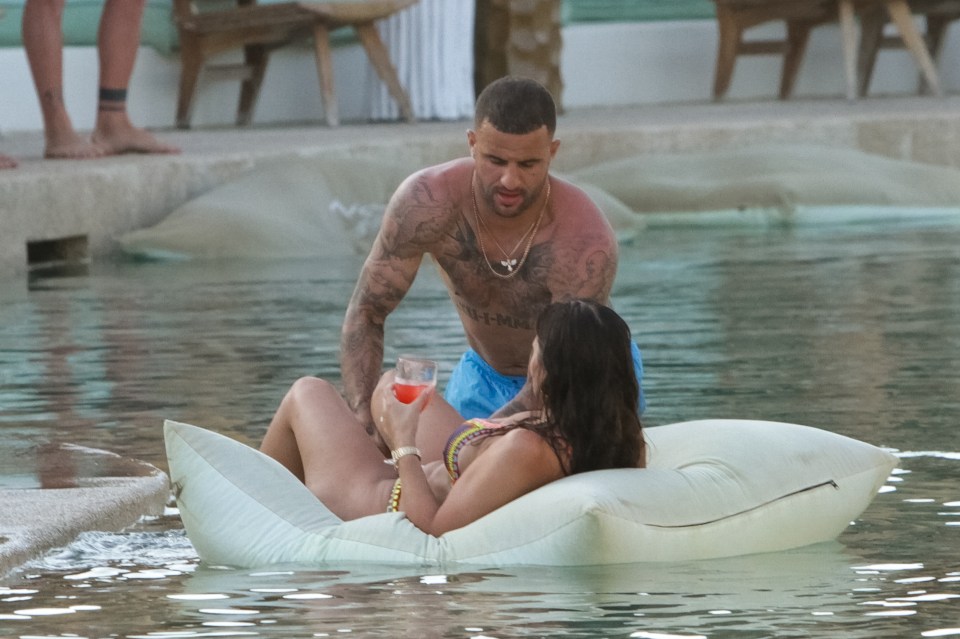 The pair chill out on an inflatable at the exclusive SantAnna beach club