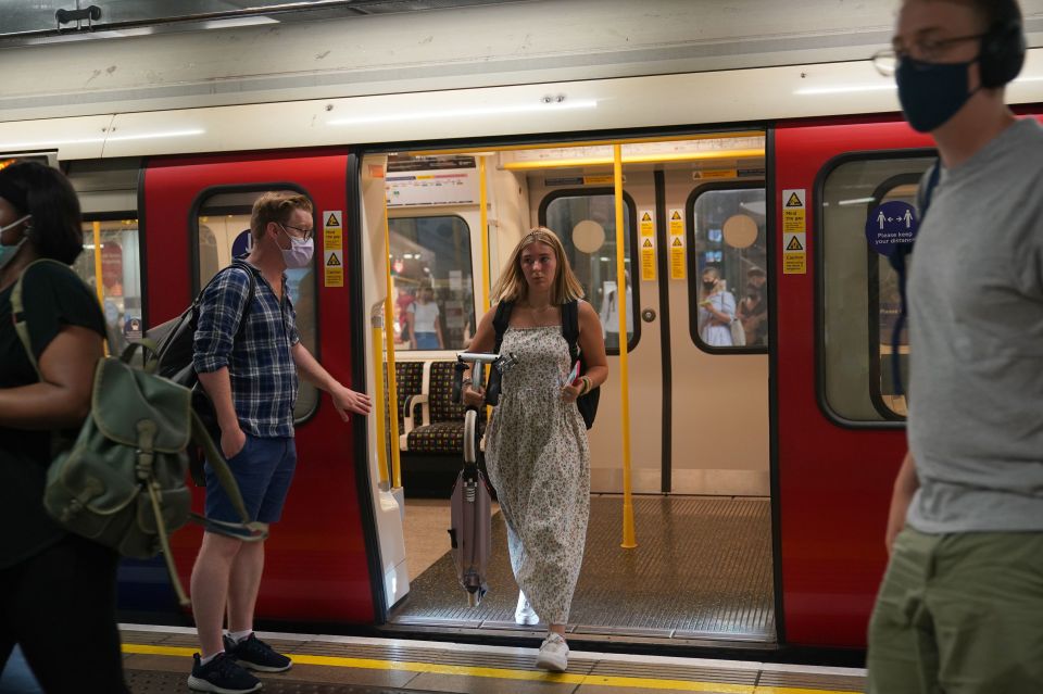 A woman exits the Tube without a mask today