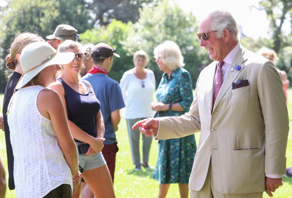 Body language expert Judi James said Charles hand-movements mimicked Camilla's, which could show he was 'anxious'