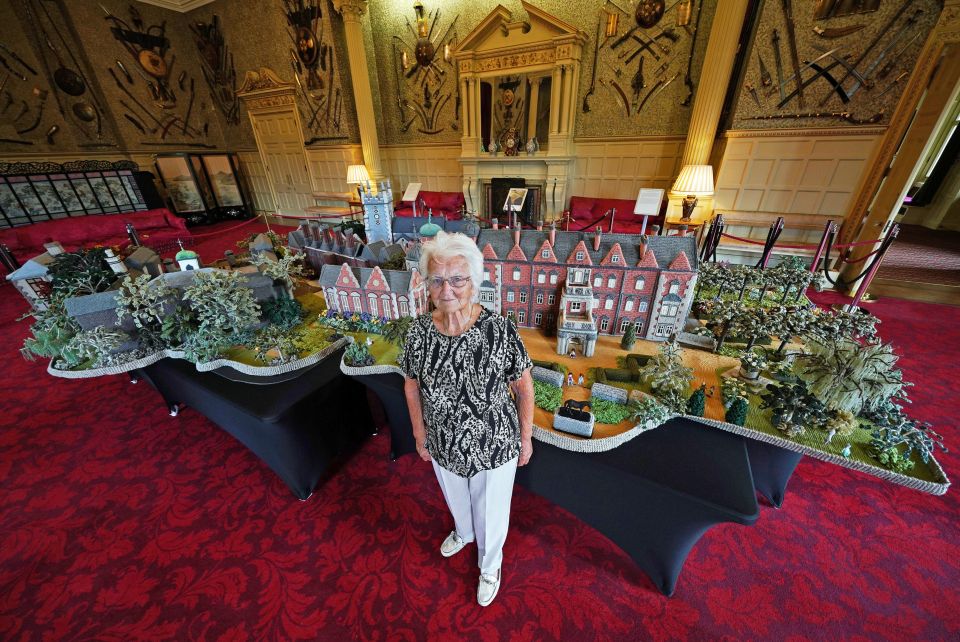 Pensioner Margaret Seaman shows off her 18ft ­version of the Queen’s Sandringham estate — painstakingly created from knitted wool