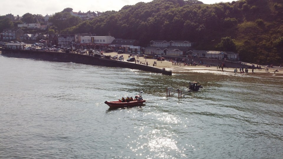 The dad and his two kids were pulled out to sea on a rip tide yesterday afternoon