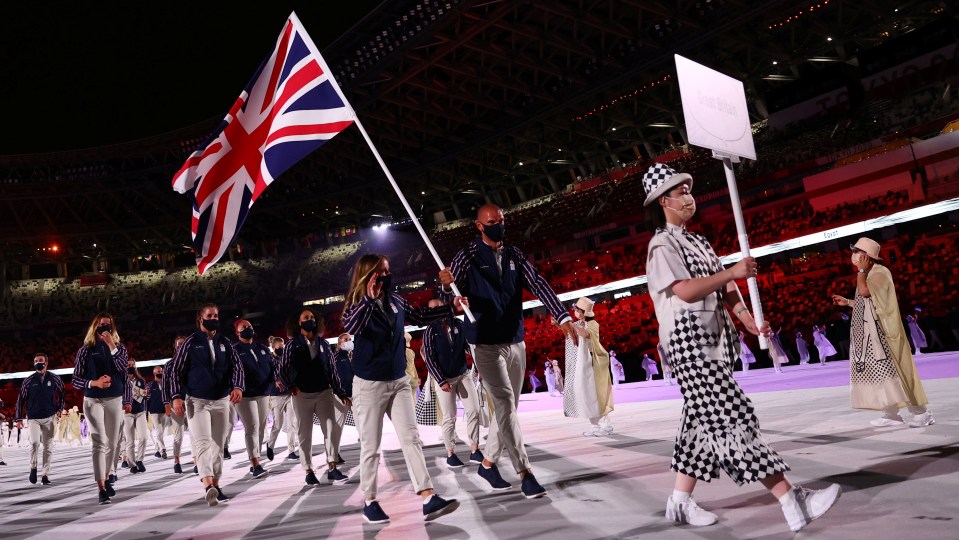 Flag bearers Mohamed Sbihi and Hannah Mills of Britain