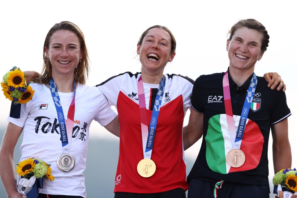 Kiesenhofer, middle, earned gold in the road race