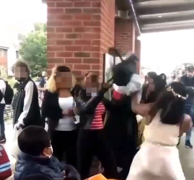 The woman in red accused the lady in the pink dress of spitting at her