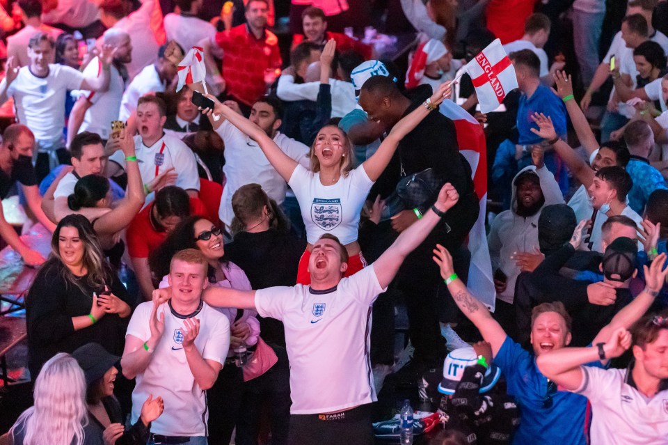 Fans celebrate England reaching the final at Boxpark in Croydon