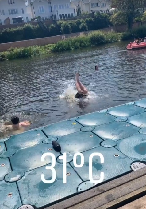 In a clip, the boxer records his pals as they jump into the water during the heatwave