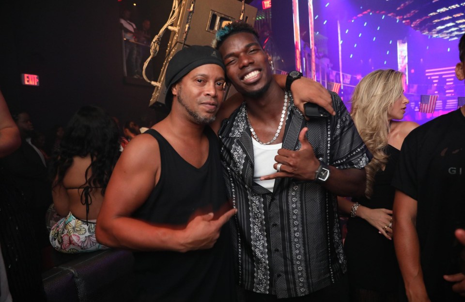 Pogba, pictured with Brazil icon Ronaldinho, is currently enjoying a break in Miami