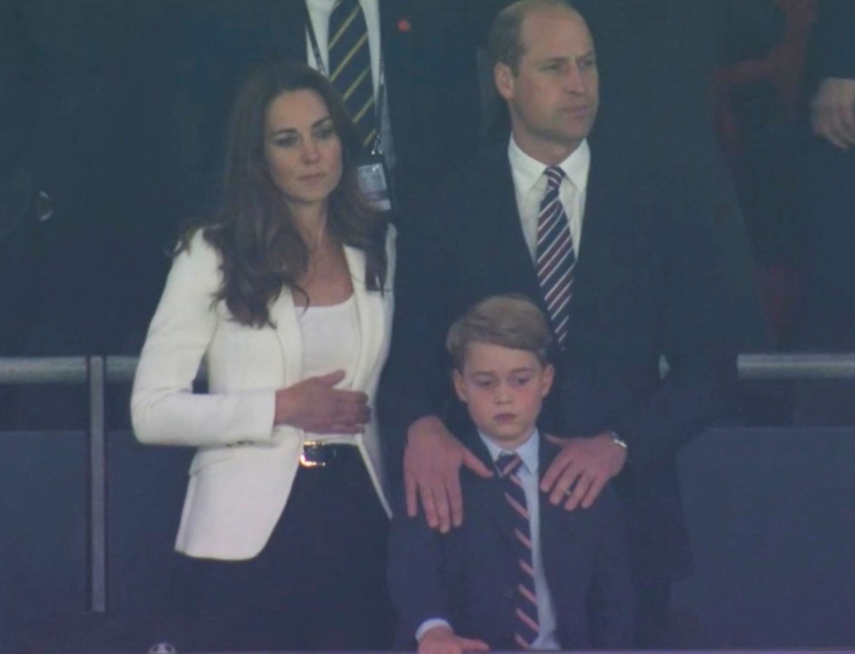 He, Kate and son George looked sombre as the game came to an end yesterday