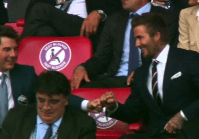 Tom Cruise and David Beckham are caught on camera with their touching moment to celebrate England's early opener