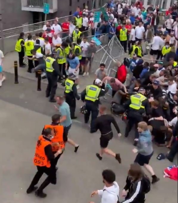 Stewards try to stop them from entering the perimeter