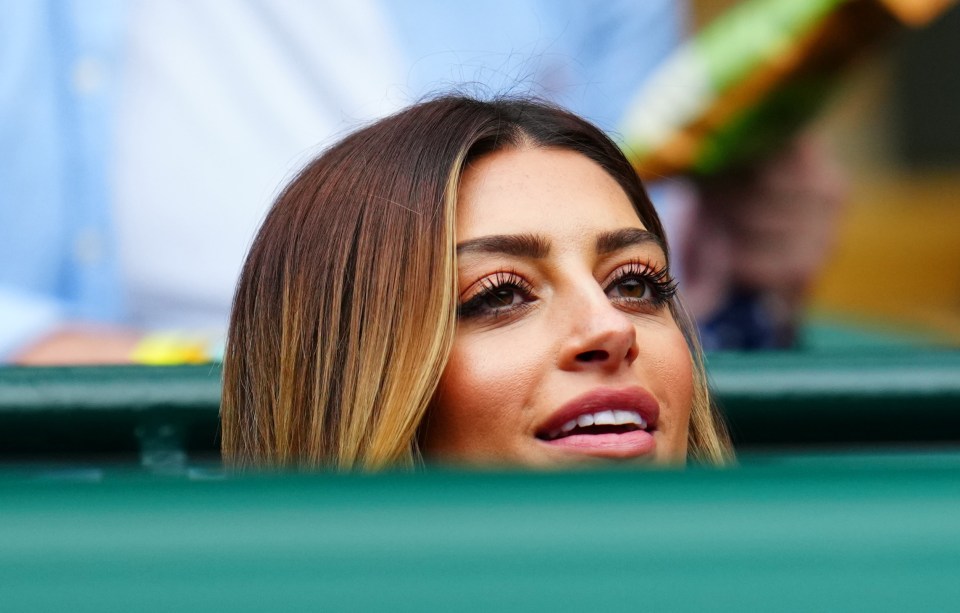 Aleah watching Evans from the stands at Wimbledon