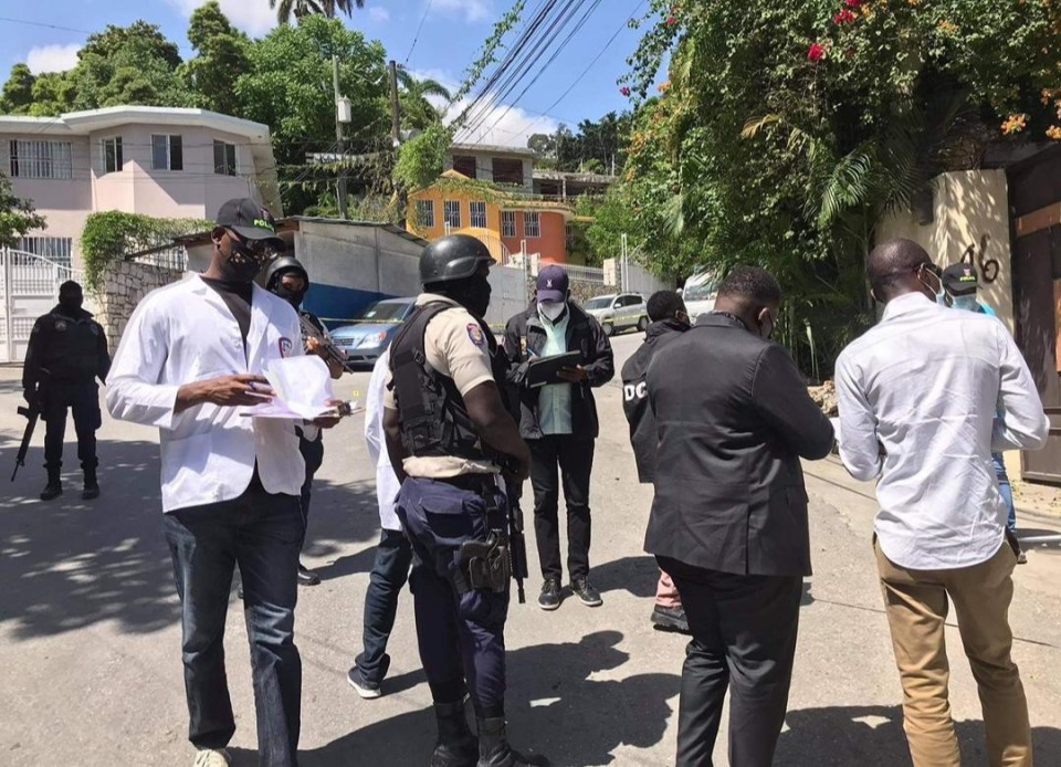 Security forces inspect the site