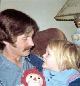 John McAfee with his daughter in 1974