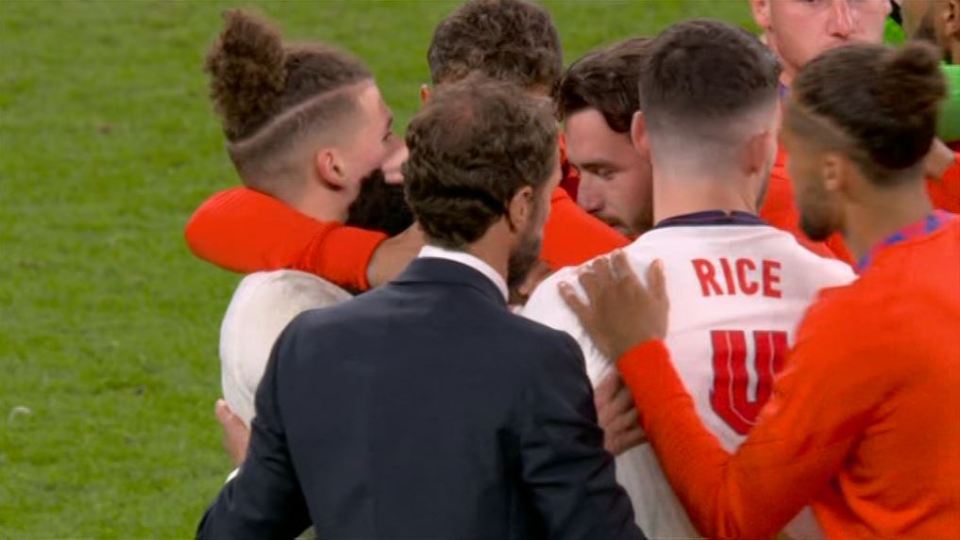 England star Bukayo Saka is consoled by his team-mates after missing the final penalty