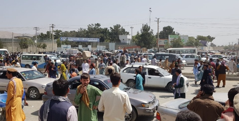 Hundreds of people gathered outside the airport in Kabul to flee the country