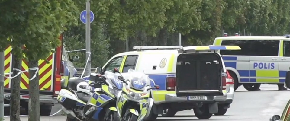 Police cars outside of the school in the Swedish town of Eslöv