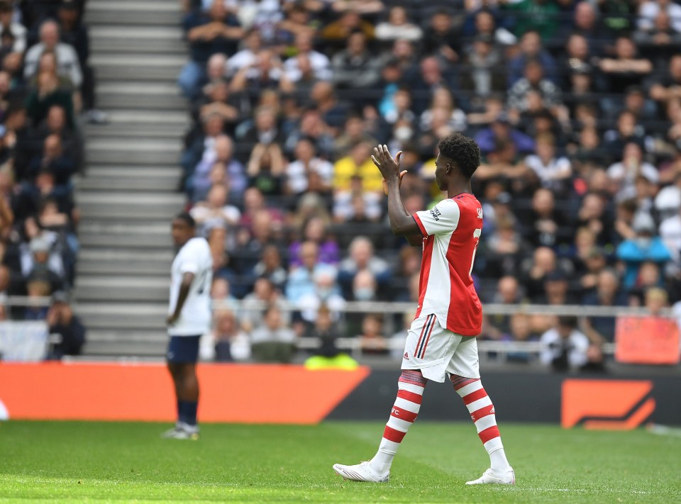 Bukayo Saka applauded fans at the Tottenham Hotspur Stadium after he was greeted with a standing ovation