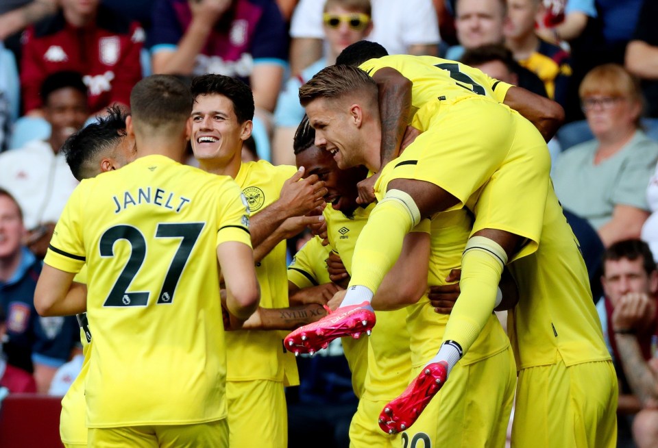 Brentford celebrate opening the scoring at Villa Park