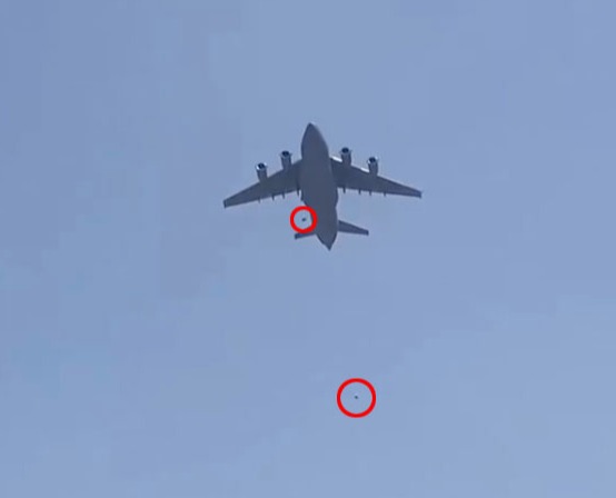 What appears the stowaways falling from a C-17 leaving Kabul