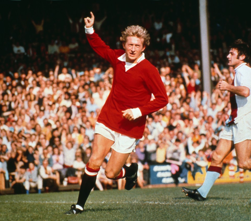 Denis Law celebrating a goal during a football match.