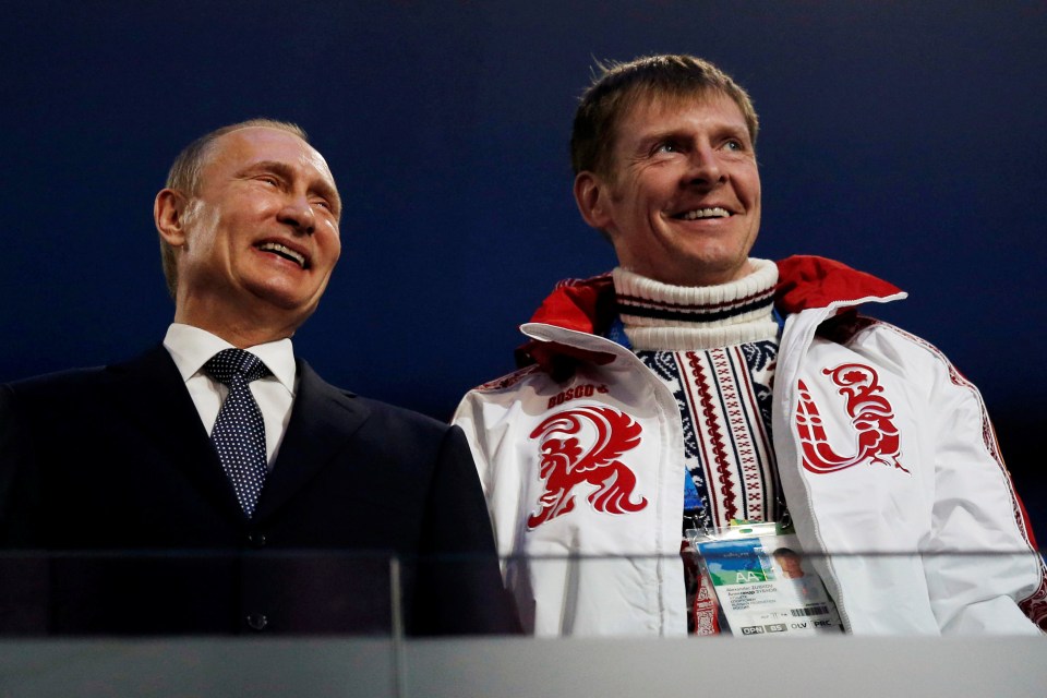 Bob-sled medallist Alexander Zubkov with President Putin at the closing ceremony in Sochi, where he won his second gold. He was later stripped of his medals.