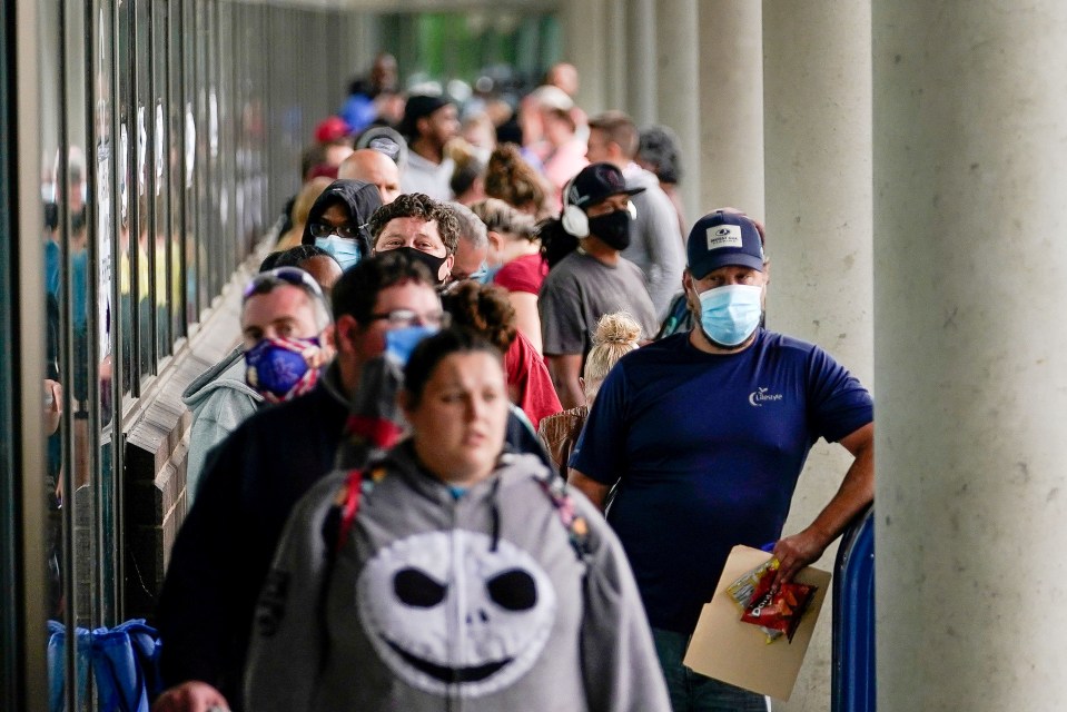 Hundreds of people line up outside a Kentucky Career Center hoping to find assistance with their unemployment claim