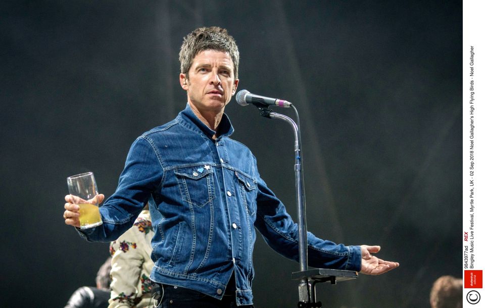 Noel enjoys a drink on stage during the Bingley Music Live Festival in 2018