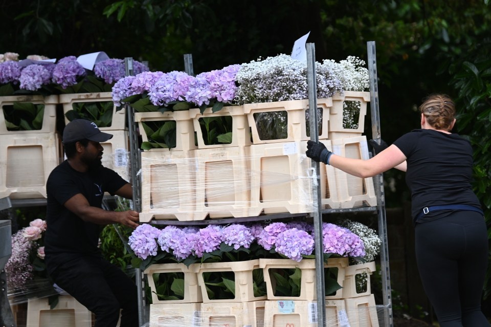 The flowers and shrubs were unloaded from a large truck at the venue