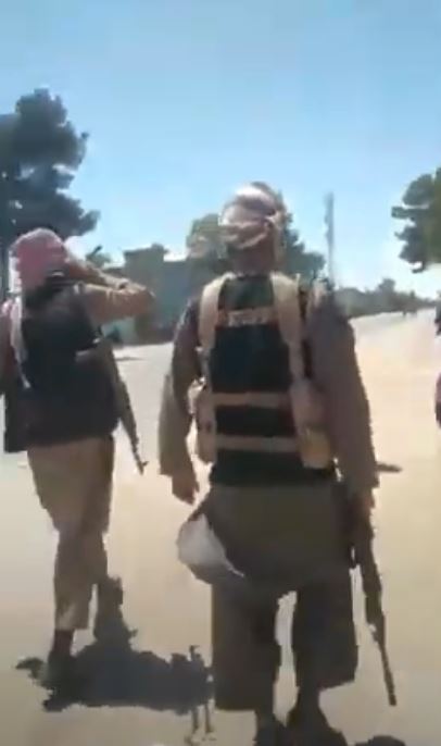 Armed Taliban fighters entering the city of Zaranj