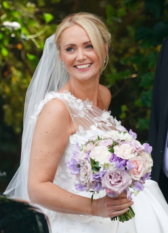 Anne-Marie looked stunning in her bespoke wedding down and delicate accessories