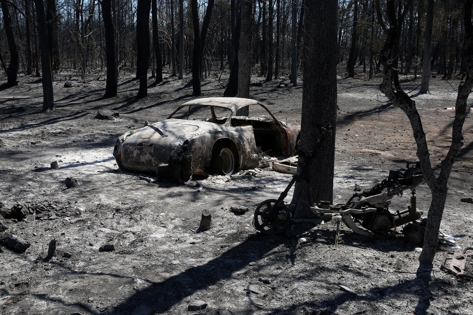 The charred remains of a car destroyed by the flames