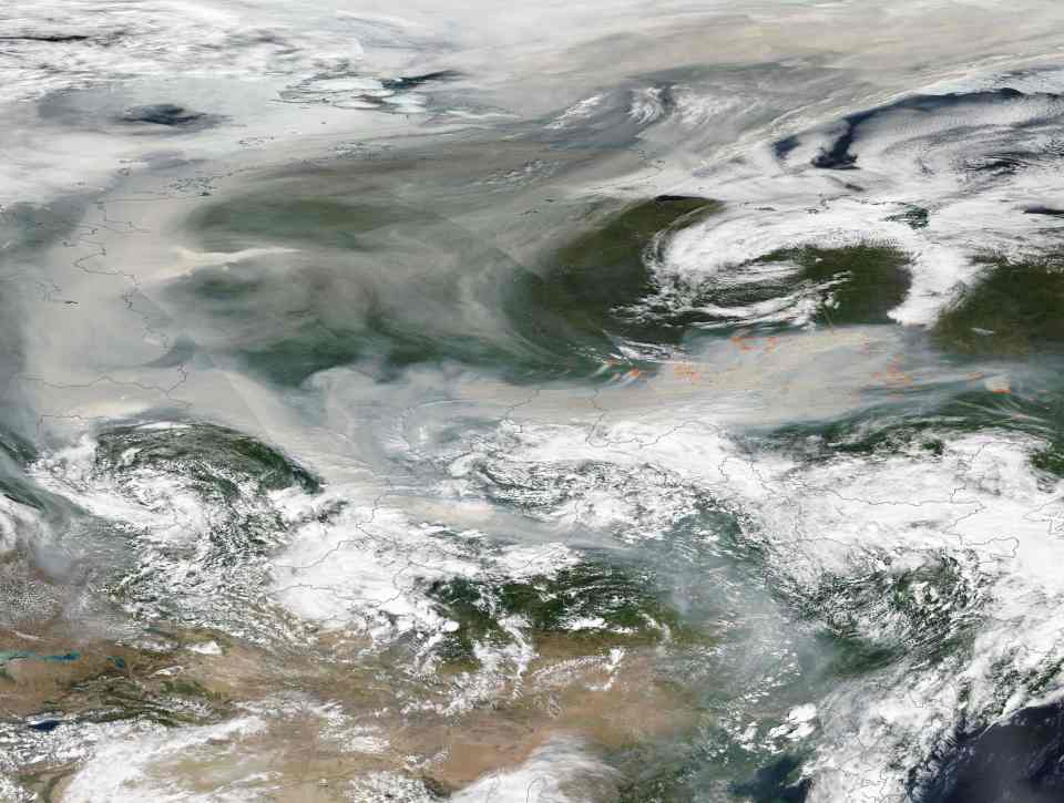 Thick smoke from the wildfires in Russia obscured the view of the land below