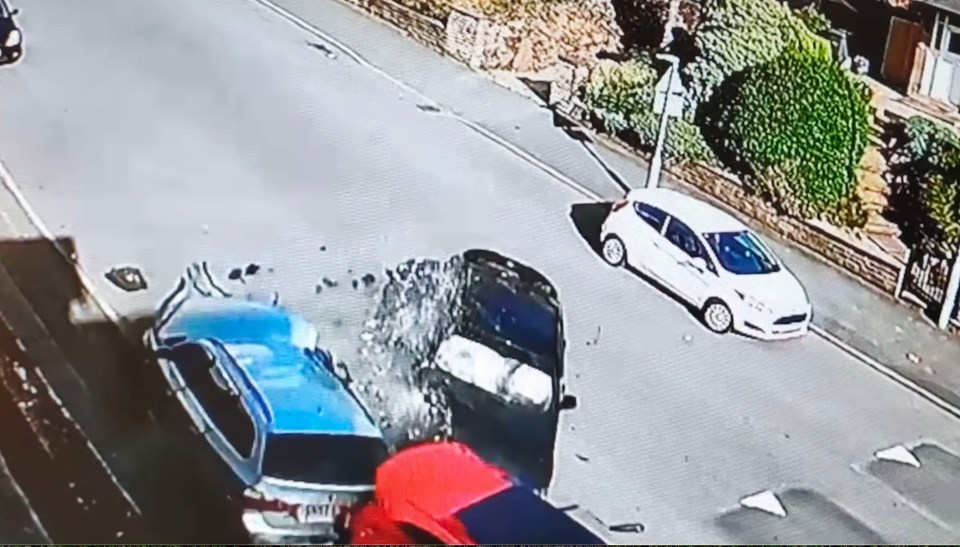 CCTV caught the moment the BMW car crashed into parked cars before flipping over