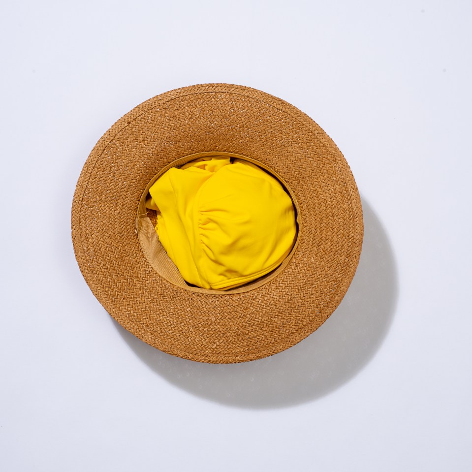 Stuff your hat with items which will keep their shape, like a bikini