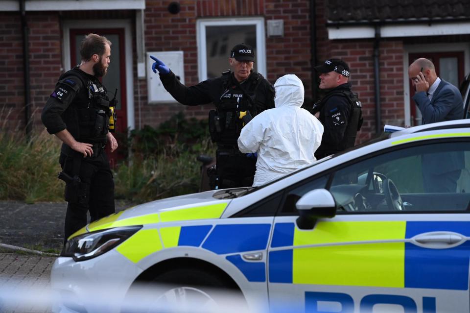 Forensics worked alongside armed police officers on the scene near Northdown Crescent