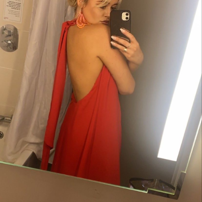 Emily looked amazing in her red backless dress