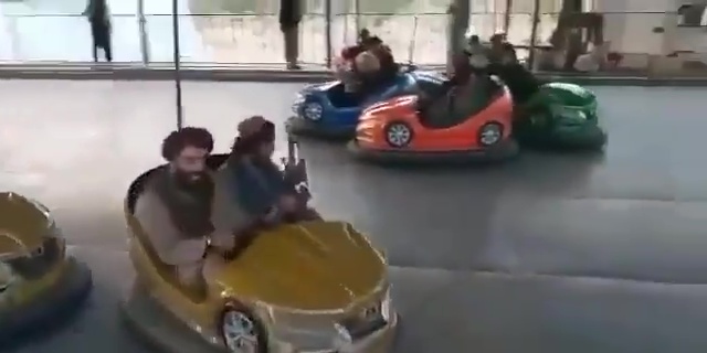 Taliban fighters at the theme park