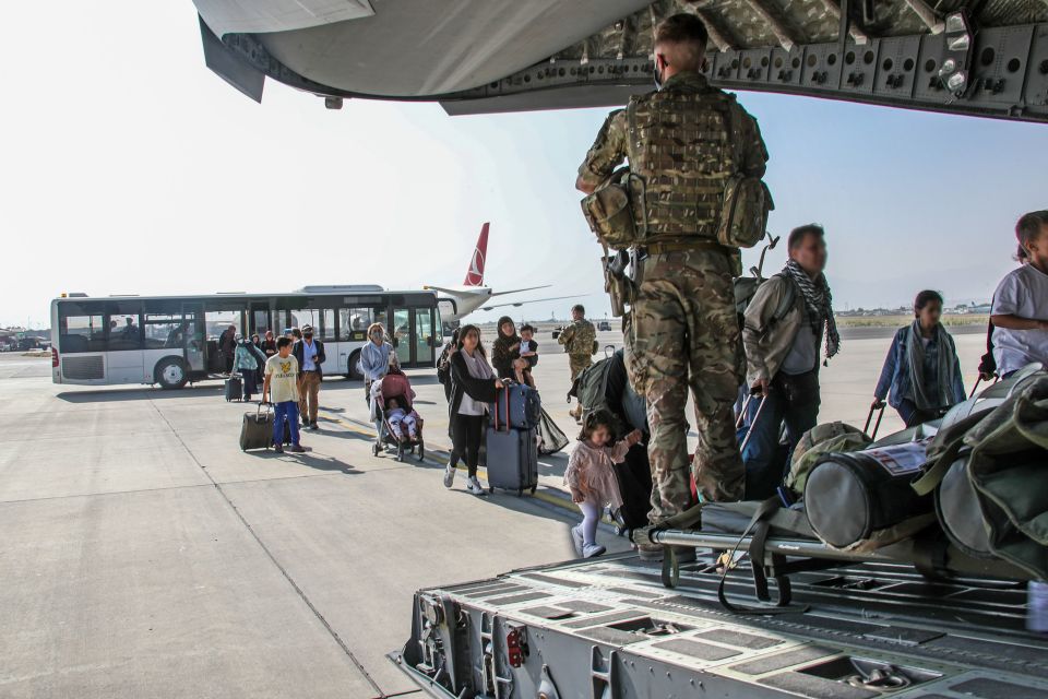 British citizens and dual nationals in Afghanistan getting on a RAF plane before being evacuated to the UK