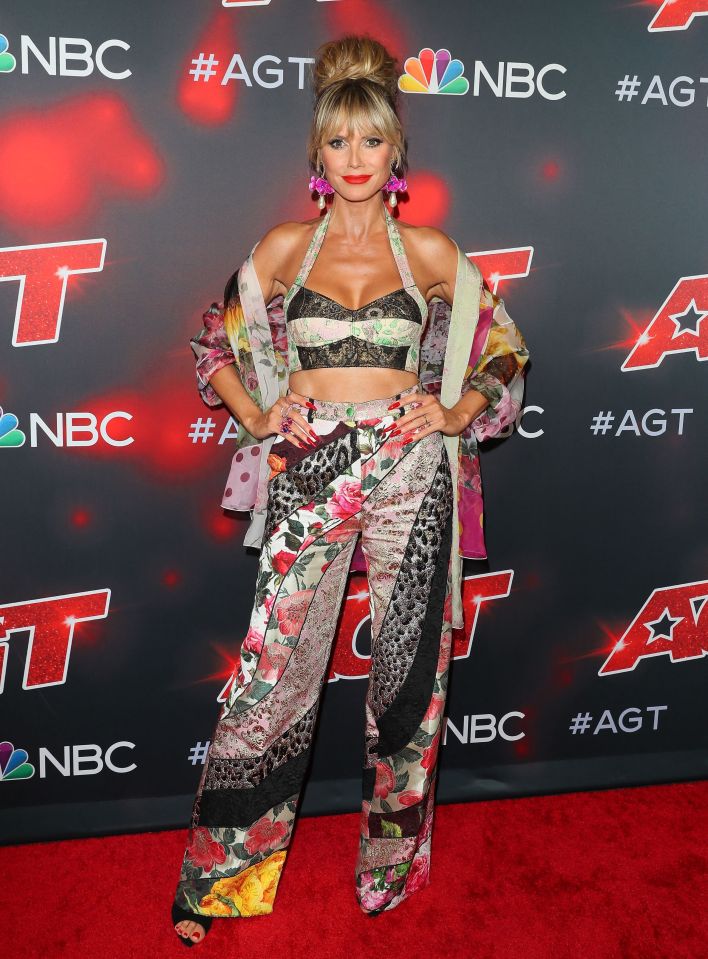 The panel judge wore patchwork-style trousers, a crop top and a kimono